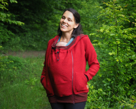 Red babywearing hoodie from boiled wool with merino cuffs